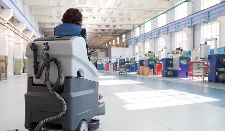 Commercially cleaning VCT tile with an autoscrubber