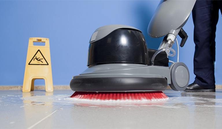 Commercially cleaning VCT tile with an autoscrubber